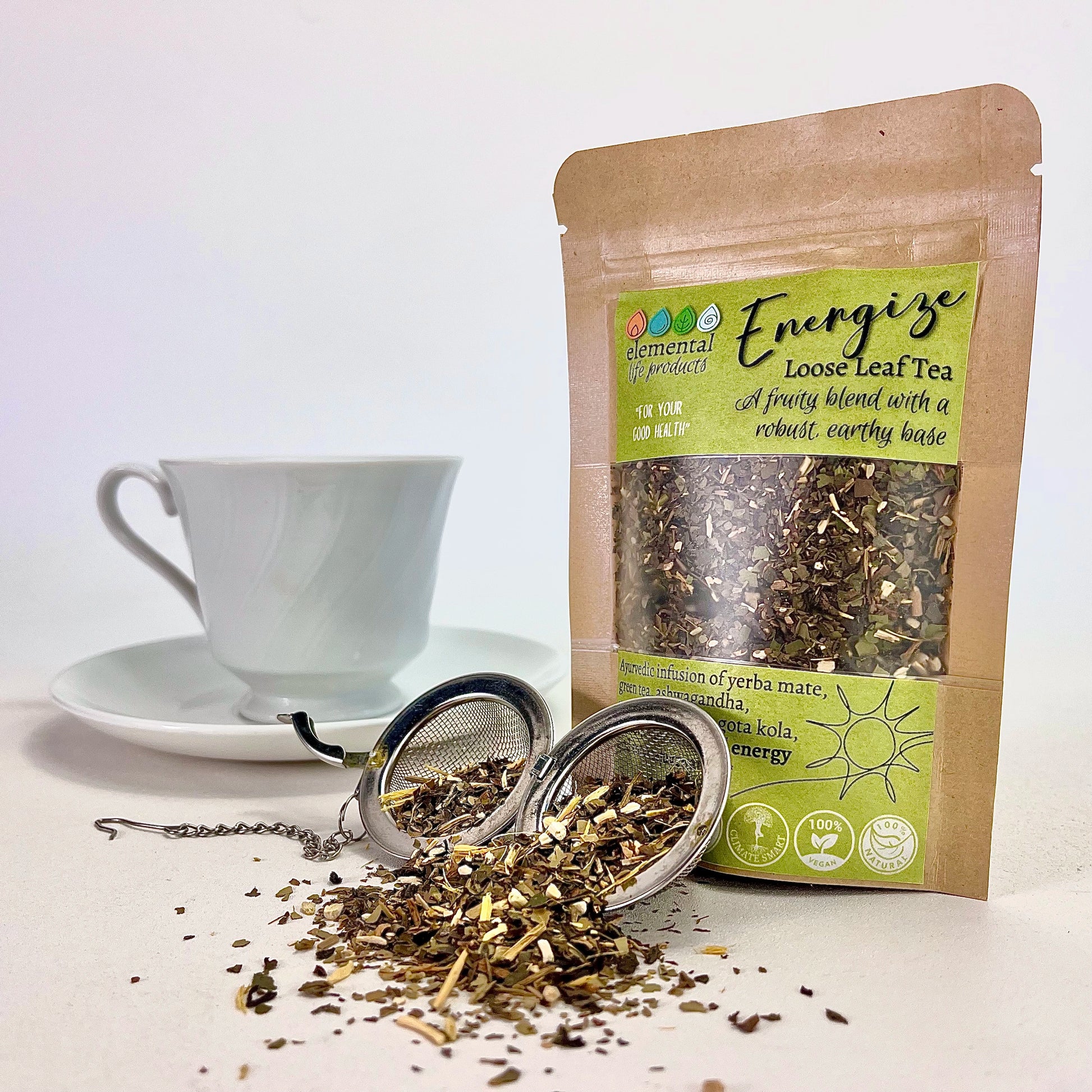 Elemental Life Product's Energize loose leaf tea blend with yerba mate, green tea, and ashwagandha with tea ball and tea cup